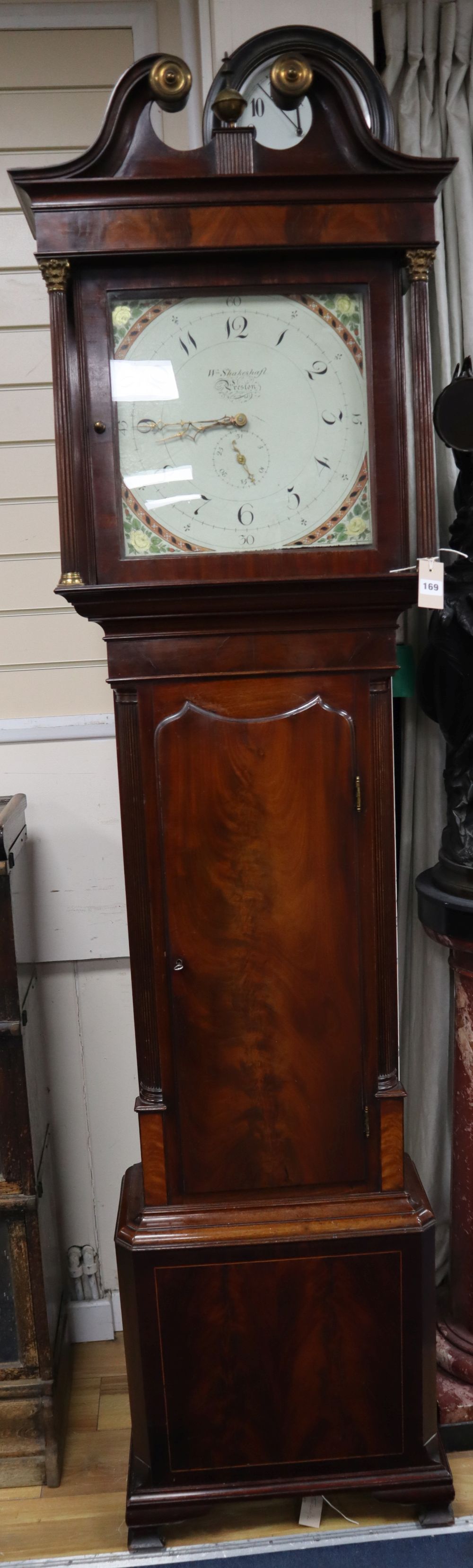 A George III mahogany longcase clock, having thirty-hour movement with 14 inch square dial signed Wm.